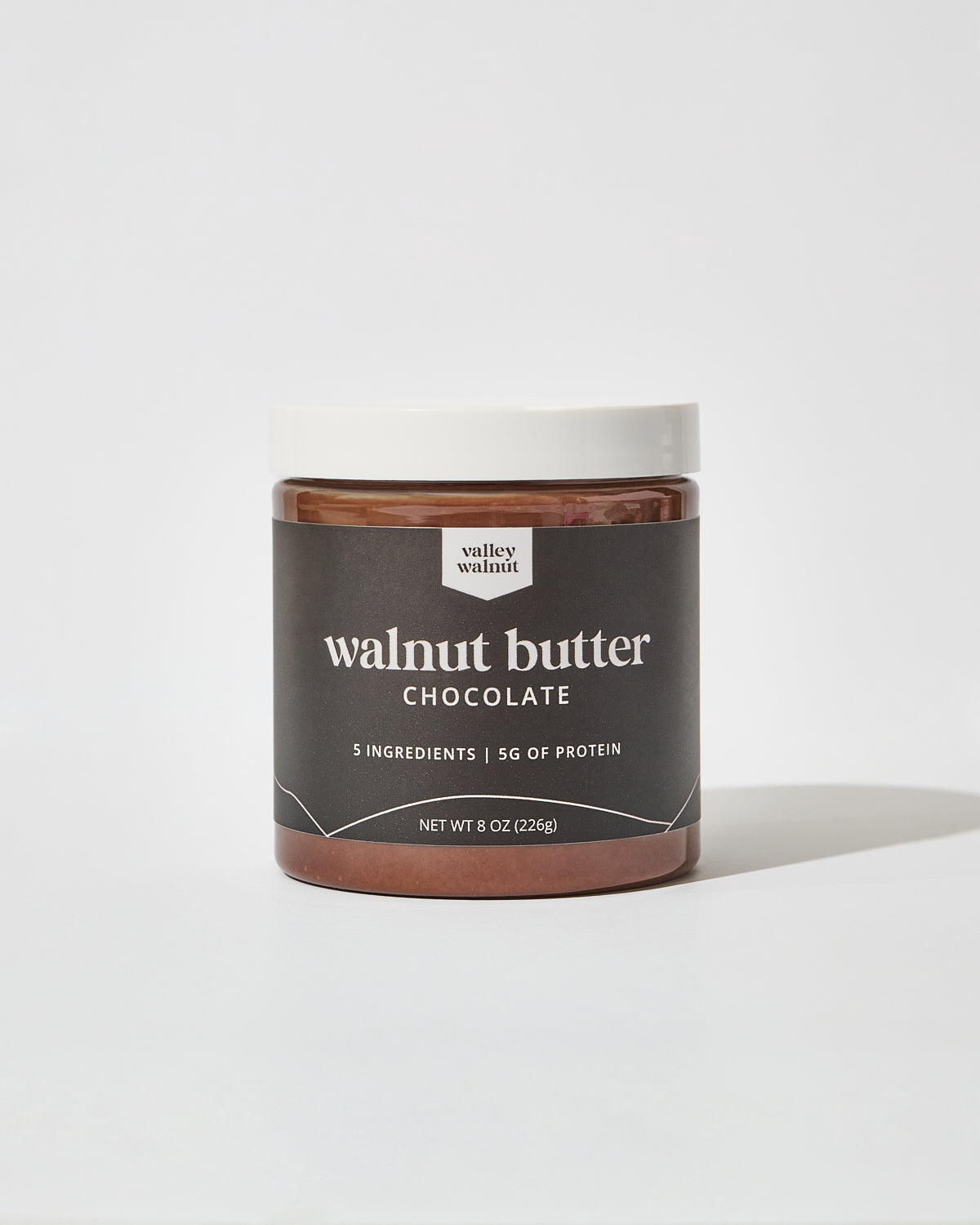 A jar of Valley Walnut Chocolate Walnut Butter on a clean white background.