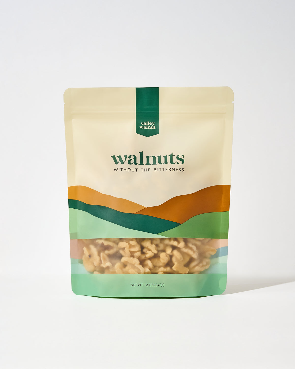 A stand-up pouch of Valley Walnut brand walnuts on a clean white background.