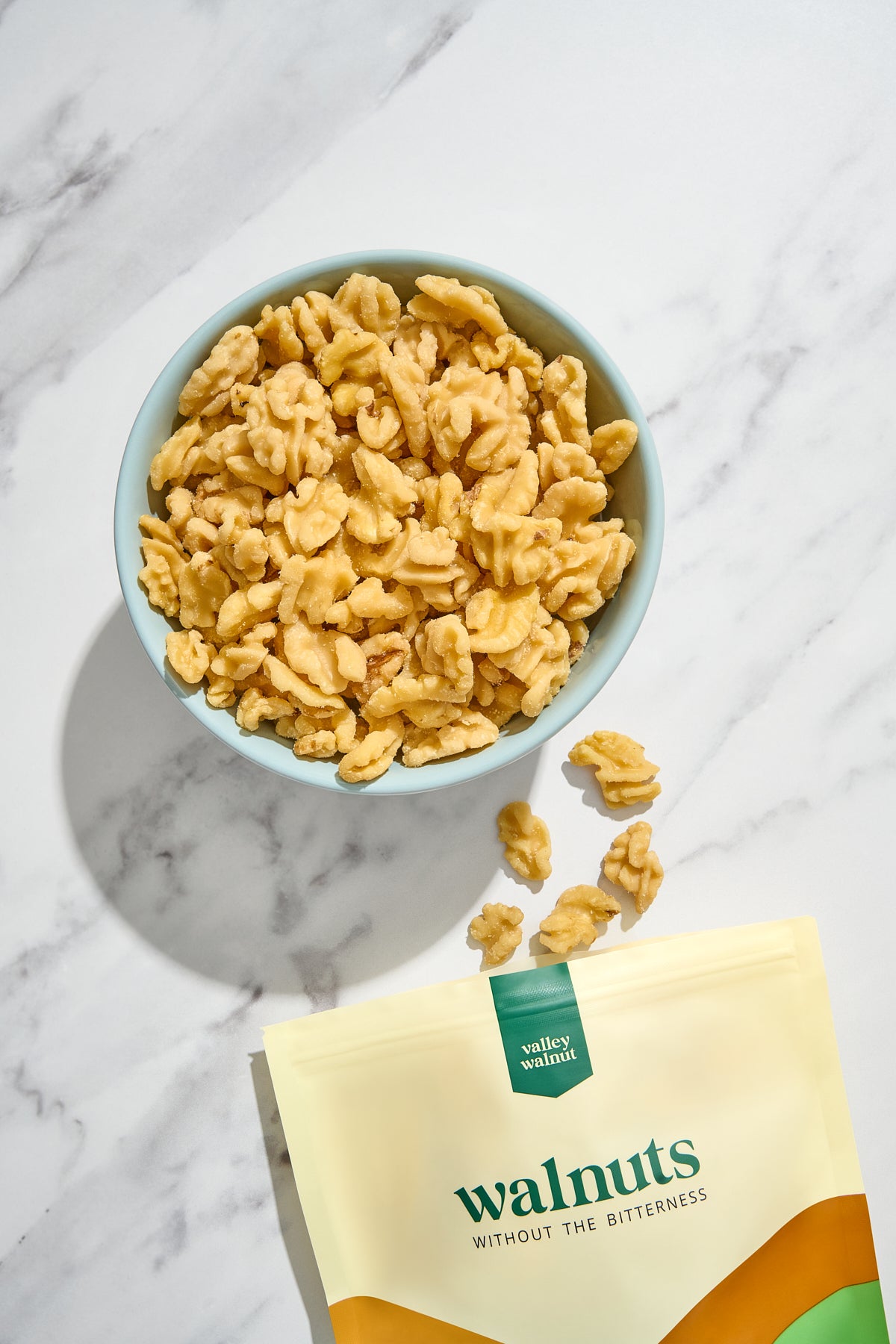 A bowl filled with our skinless walnuts.