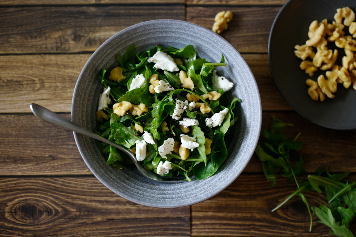 Arugula salad with skinless walnuts and feta